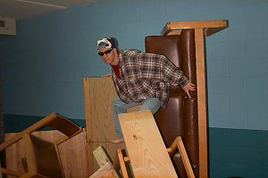 Guy climbing furniture
